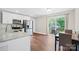 Bright eat-in kitchen with stainless appliances, granite countertops, and sliding glass doors to deck at 1013 Old Charlotte Rd, Statesville, NC 28677