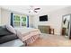 Spacious main bedroom featuring carpet, a ceiling fan, and plenty of natural light at 1013 Old Charlotte Rd, Statesville, NC 28677
