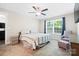 Comfortable main bedroom featuring a ceiling fan, natural light, and neutral colors at 1013 Old Charlotte Rd, Statesville, NC 28677