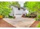 A two-story house with a garage, a deck, and beautiful landscaping around the property at 1023 Evian Ln, Matthews, NC 28105