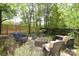 Outdoor fire pit area with comfortable seating and a charming backyard fence at 1023 Evian Ln, Matthews, NC 28105