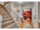 Welcoming foyer with hardwood floors, staircase, and a view into the dining room at 1023 Evian Ln, Matthews, NC 28105