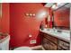Stylish half bathroom with a modern vanity, decorative mirror, and fresh paint at 1023 Evian Ln, Matthews, NC 28105