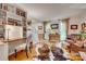 Bright living room featuring hardwood floors, custom bookshelves, and comfortable seating at 1023 Evian Ln, Matthews, NC 28105