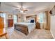Bright primary bedroom features plush carpet, large bed, and natural light at 1023 Evian Ln, Matthews, NC 28105