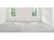 Bright, airy bedroom with neutral carpet and ample natural light from two large windows at 106 Kirsche Ct, Mooresville, NC 28115