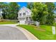 Charming two-story home with a manicured lawn, featuring stone accents and a two-car garage at 106 Kirsche Ct, Mooresville, NC 28115
