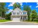 Charming two-story home with stone accents, a two-car garage, and a well-maintained front yard at 106 Kirsche Ct, Mooresville, NC 28115