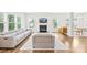 Inviting living room features recessed lights, large windows, a fireplace, and modern furniture at 106 Kirsche Ct, Mooresville, NC 28115