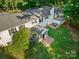Aerial view of a white house with an enclosed porch and outdoor deck at 108 Augusta Dr, Statesville, NC 28625
