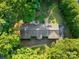 Aerial view of a single-story home with mature trees and a long driveway at 108 Augusta Dr, Statesville, NC 28625