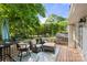 Outdoor back deck featuring comfortable seating, lush greenery, and serene views at 108 Augusta Dr, Statesville, NC 28625
