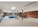 Spacious basement with carpeted flooring, pool table, and fireplace, great for entertaining at 108 Augusta Dr, Statesville, NC 28625