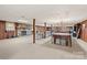 Open basement featuring a fireplace, pool table, and living area, perfect for entertaining at 108 Augusta Dr, Statesville, NC 28625