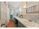 Bathroom featuring double sinks, decorative backsplash and updated fixtures, ample lighting at 108 Augusta Dr, Statesville, NC 28625