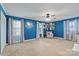 Spacious bedroom with blue walls and ceiling fan, bathed in natural light at 108 Augusta Dr, Statesville, NC 28625