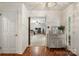 Foyer featuring hardwood floors, a decorative cabinet, chandelier, and a view into the living area at 108 Augusta Dr, Statesville, NC 28625