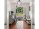 Inviting foyer with hardwood floors, an elegant chandelier, and views of the front yard at 108 Augusta Dr, Statesville, NC 28625