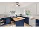 Stylish kitchen featuring white cabinetry, stainless appliances, and a functional center island at 108 Augusta Dr, Statesville, NC 28625