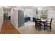 Charming kitchen with a dining area, stainless steel appliances, and white cabinetry with black hardware at 108 Augusta Dr, Statesville, NC 28625