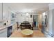 Inviting kitchen with stainless refrigerator, open access to dining area and white appliances at 108 Augusta Dr, Statesville, NC 28625