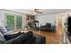 Cozy living room with parquet floors, a decorative fireplace and access to the outside via a glass paneled door at 108 Augusta Dr, Statesville, NC 28625