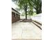 Back patio with outdoor seating and mature shade tree at 11 N 10Th Ave, Maiden, NC 28650