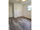 This bedroom features modern flooring, a closet and a window providing plenty of natural light at 11 N 10Th Ave, Maiden, NC 28650