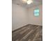Bright bedroom with sleek flooring, neutral walls, and lots of natural light coming in from the window at 11 N 10Th Ave, Maiden, NC 28650