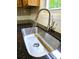 Close up of the kitchen sink with a modern faucet and elegant granite countertops at 11 N 10Th Ave, Maiden, NC 28650