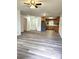 Inviting living room featuring modern flooring and an open floor plan to the kitchen at 11 N 10Th Ave, Maiden, NC 28650