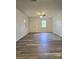 Bright living room with sleek flooring, neutral walls, and lots of natural light at 11 N 10Th Ave, Maiden, NC 28650
