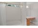 Bright bathroom showcases a bathtub and shower combination with a window, vanity and decorative mirror at 111 Wilton Pl, Mooresville, NC 28117