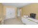 This bedroom features neutral carpet, ample closet space, and sewing machine area at 111 Wilton Pl, Mooresville, NC 28117