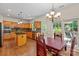 Well-appointed kitchen with custom wood cabinets, stainless appliances, and an island at 111 Wilton Pl, Mooresville, NC 28117