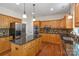 Modern kitchen with center island, stainless steel appliances, and ample cabinet space at 111 Wilton Pl, Mooresville, NC 28117