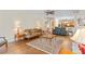 Open-concept living room with hardwood floors, seamlessly connecting to other living spaces at 111 Wilton Pl, Mooresville, NC 28117