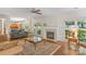 Inviting living room featuring a cozy fireplace and ample natural light for relaxation at 111 Wilton Pl, Mooresville, NC 28117