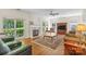 Bright living room with a fireplace and large windows offering scenic views at 111 Wilton Pl, Mooresville, NC 28117