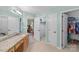 The bathroom features double sinks, tile floors, a large closet, and ample storage space at 111 Wilton Pl, Mooresville, NC 28117