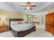 The primary bedroom offers a ceiling fan, neutral carpet, and an attached ensuite bathroom at 111 Wilton Pl, Mooresville, NC 28117