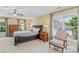 Spacious primary bedroom features a tray ceiling, neutral carpet, and ample natural light at 111 Wilton Pl, Mooresville, NC 28117
