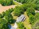 Sprawling home featuring mature trees, deck, and scenic surroundings at 1207 Carlson Dr, Monroe, NC 28110