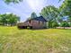 Beautiful backyard with lush green grass and a spacious wooden deck at 1207 Carlson Dr, Monroe, NC 28110