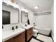 Modern bathroom with double vanity, sleek fixtures, and a standalone soaking tub at 1207 Carlson Dr, Monroe, NC 28110