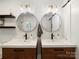 Stylish bathroom featuring dual sinks, elegant lighting fixtures, and modern design at 1207 Carlson Dr, Monroe, NC 28110