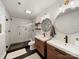 Contemporary bathroom with dual vanities, modern fixtures, a large walk-in shower with subway tile at 1207 Carlson Dr, Monroe, NC 28110