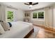 Bright bedroom with hardwood floors, large windows providing natural light, and comfortable furnishings at 1207 Carlson Dr, Monroe, NC 28110