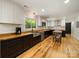 Modern kitchen with white cabinets, wood countertops, and stainless steel appliances at 1207 Carlson Dr, Monroe, NC 28110