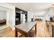 Bright kitchen featuring stainless steel appliances, a center island, and an open view of the dining and living area at 1207 Carlson Dr, Monroe, NC 28110